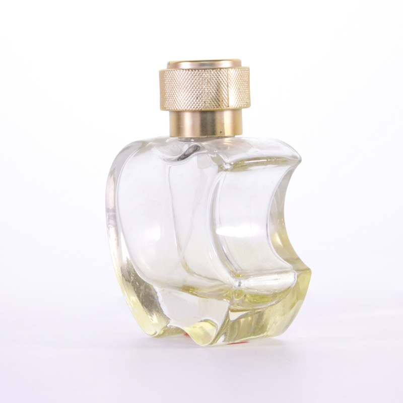 Empty Yellow Glass Cologne Bottle